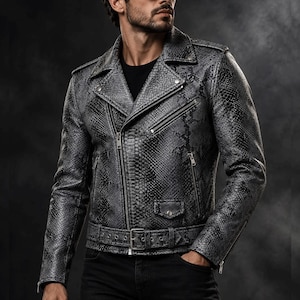 May include: A grey and black snakeskin-patterned leather motorcycle jacket featuring a notched lapel, an asymmetrical front zipper closure, multiple zippered pockets, a small flap pocket, and a buckled belt at the waist.