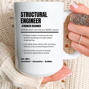 May include: A white ceramic mug featuring black text that defines a structural engineer as a strength designer. The text includes a phonetic pronunciation, a three-point description of engineering duties, and a see also section listing architect, innovator, and builder.