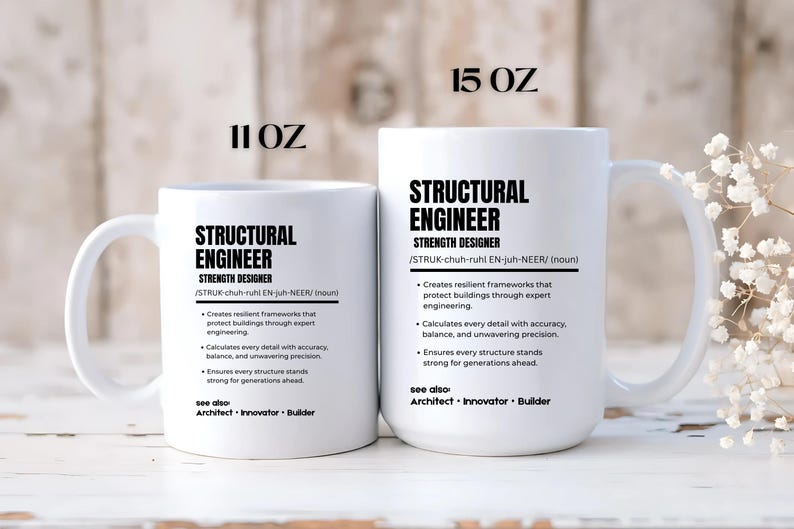 May include: Two white ceramic mugs with black text. The smaller mug is labeled 11 oz and the larger is 15 oz. Both feature the definition of a structural engineer, including the phonetic pronunciation, bulleted job duties, and see also terms.