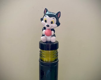 Figaro Cat Bottle Stopper. Top your wine or liquor bottle with this unique topper.