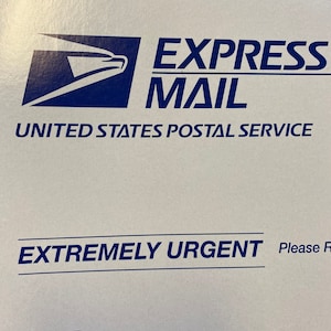 May include: A white envelope with blue text that reads "EXPRESS MAIL" and "UNITED STATES POSTAL SERVICE". The envelope also has the text "EXTREMELY URGENT" and "Flat Rate Mailing Envelope" in blue text.