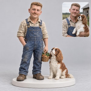 May include: A custom figurine of a person with a mustache wearing a plaid shirt and blue denim overalls, holding a small woven basket filled with vegetables. Beside the person sits a brown and white Cavalier King Charles Spaniel dog.