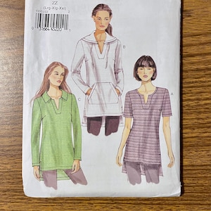 May include: A Very Easy Vogue sewing pattern, V8951, featuring three tunic designs. The pattern includes a hooded tunic, a long-sleeved tunic, and a short-sleeved tunic. The pattern is size ZZ (Lrg-Xlg-XXl).