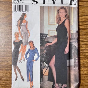 May include: A sewing pattern envelope labeled 2537 STYLE featuring illustrations of three dress variations: a sleeveless knee-length dress, a short-sleeved knee-length dress, and a long-sleeved midi dress, alongside a photograph of a long black dress.