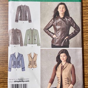 May include: Simplicity sewing pattern 2341 for jackets and vests in sizes U5 16, 18, 20, 22, 24. The envelope displays illustrations of five garment variations, including long-sleeved jackets and sleeveless vests with front closures and pockets.