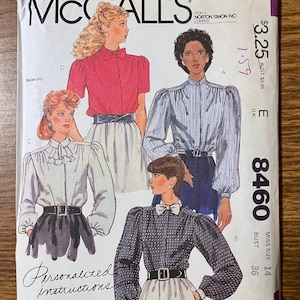 May include: A McCalls 8460 sewing pattern envelope featuring illustrations of four different blouse styles with long or short sleeves, high necklines, and belts. The text includes McCalls, 8460, Miss Size 14, Bust 36, and Personalized instructions.
