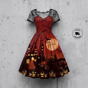 May include: A knee-length dress featuring a red bodice with a black bat print and short black lace sleeves. The skirt displays a dark landscape with a large yellow moon, a silhouette of a haunted house, bare trees, and glowing jack-o'-lanterns.