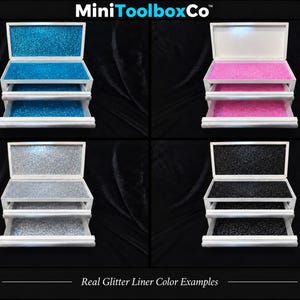 May include: Four white multi-tiered storage chests with open drawers and lids, each featuring a different colored glitter liner in blue, pink, silver, or black. The text MiniToolboxCo and Real Glitter Liner Color Examples are visible.