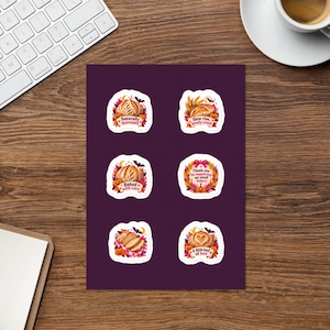 May include: A sheet of six die-cut stickers featuring illustrations of sourdough bread, pumpkins, and autumn leaves. The text includes Naturally leavened, Slow rise, lovely crust, Baked with care, Thank you for supporting my small bakery, and A little loaf of love.