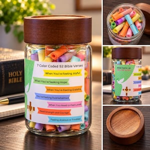May include: A clear glass jar with a dark wooden lid filled with 92 colorful paper scrolls. The label reads 7 Color Coded 92 Bible Verses with categories including When You're Feeling Joyful, Seeking Hope, Grateful, Overwhelmed, Loved, Strength, and Anxious.