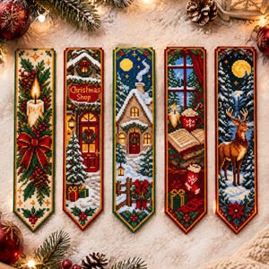 May include: Five rectangular cross-stitch bookmarks featuring holiday themes. Designs include a lit candle with holly, a Christmas shop entrance, a snow-covered cottage, a window scene with a mug and book, and a deer in a snowy forest at night.