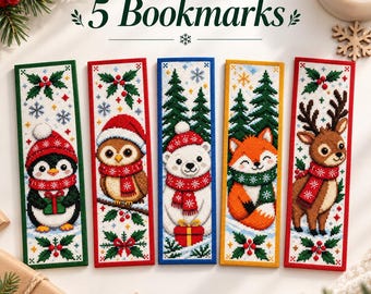 May include: Five rectangular cross-stitch bookmarks featuring winter themes with the text 5 Bookmarks. Designs include a penguin, owl, polar bear, fox, and reindeer, all wearing red or green scarves and hats, surrounded by holly and snowflakes.