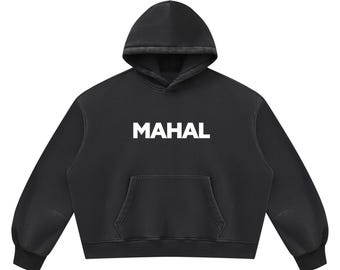 May include: A black hooded sweatshirt featuring the word MAHAL printed in bold white capital letters across the center of the chest. The garment includes a large front kangaroo pocket, long sleeves with ribbed cuffs, and a matching black hood.