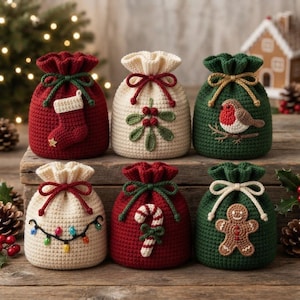 May include: Six small crochet drawstring bags in red, cream, and green. The bags feature festive appliqués including a stocking, mistletoe, a robin, string lights, a candy cane, and a gingerbread man, each tied with a matching yarn cord.