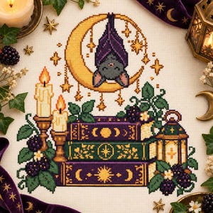 May include: A cross-stitch pattern featuring a gray bat hanging from a yellow crescent moon surrounded by stars. Below, three stacked books in purple and green are decorated with celestial symbols, flanked by two lit candles and a lantern.