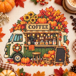 May include: A cross-stitch pattern on white fabric depicting a green coffee truck adorned with autumn leaves, sunflowers, and pumpkins. The truck features a service window, a wooden stool, and a chalkboard sign. The word COFFEE is printed above.