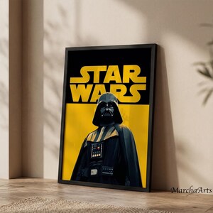 May include: A framed wall art print featuring Darth Vader in a black helmet and cape against a yellow and black background. The text STAR WARS is printed in large yellow letters at the top. The artwork is enclosed in a thin black frame.