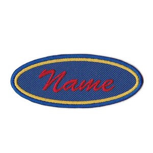 May include: Blue oval name tag with a yellow border and the word "Name" embroidered in red.