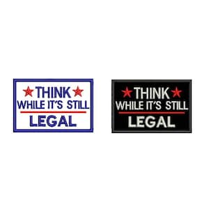 May include: Two embroidered patches with the text "Think while it's still legal" in white lettering with red stars on a blue and black background.