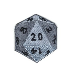 May include: A gray embroidered patch shaped like a twenty-sided die with the numbers 1 through 20 on each side. The die is a common item used in tabletop role-playing games.