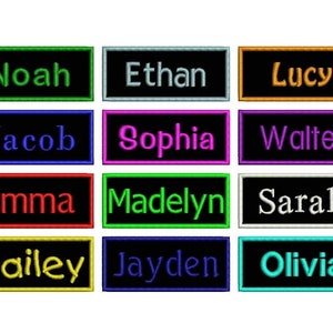 May include: Twelve black rectangular name tags with white, green, blue, red, yellow, orange, purple, and teal embroidered names. The names are Noah, Ethan, Lucy, Jacob, Sophia, Walter, Emma, Madelyn, Sarah, Hailey, Jayden, and Olivia.