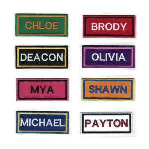 May include: Eight colorful rectangular name tags with embroidered names. The names are Chloe, Brody, Deacon, Olivia, Mya, Shawn, Michael, and Payton.