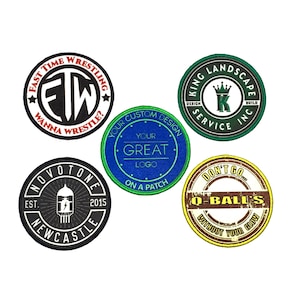 May include: Five embroidered patches with different designs. The patches are circular and have a variety of colors, including black, white, red, green, blue, yellow, and brown. The patches feature text, logos, and graphics.