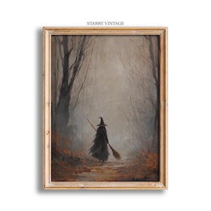 May include: A framed wall art print titled STARRY VINTAGE featuring a painting of a figure in a dark cloak and pointed hat walking away into a misty, autumnal forest while carrying a wooden broomstick over one shoulder amidst fallen leaves.