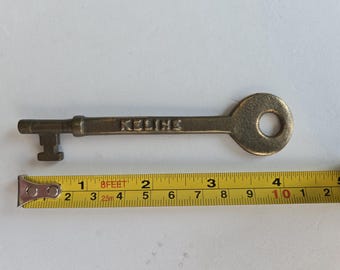 Vintage Unmarked Keline Brass Caboose/Coach Key approximately 4 1/4 inches in length.