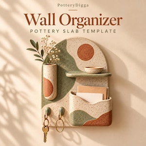 May include: A speckled ceramic wall organizer with the text PotteryDigga Wall Organizer Pottery Slab Template. It features a cylindrical vase, a small shelf with a bowl, a pocket for mail, and two hooks holding metal key rings.