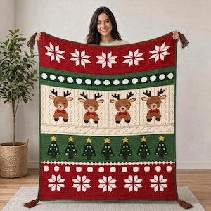 May include: A rectangular crochet blanket featuring a red, green, and cream color palette. The design includes rows of white snowflakes, green Christmas trees, and brown reindeer with red bow ties. The blanket has tassels at the corners.
