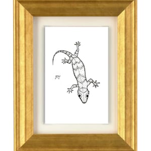 May include: A black and white ink drawing of a lizard with a stippled texture pattern, centered on a white background within a cream-colored mat. The word grey is written in small script next to the lizard. The artwork is in a gold frame.