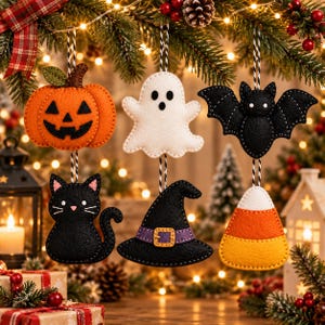 May include: Six felt Halloween ornaments hanging by black and white twine. The set includes an orange jack-o'-lantern, a white ghost, a black bat, a black cat, a black witch hat with a purple band, and a piece of orange, yellow, and white candy corn.