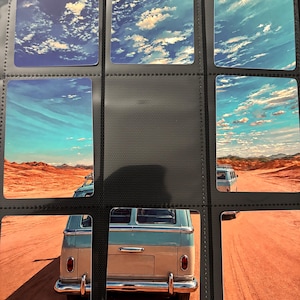 May include: A collection of nine rectangular trading cards arranged in a plastic binder sheet. The cards feature a continuous panoramic image of a light blue and white vintage van driving on a dusty orange desert road under a bright blue sky.