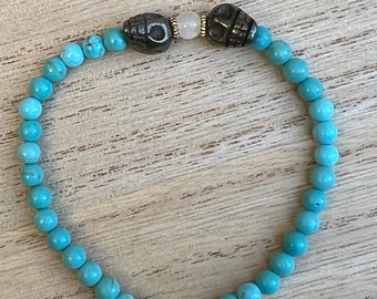 Turquoise bracelet with pyrite skulls