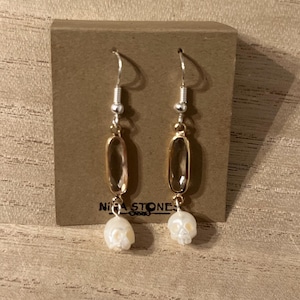 Skull Pearl dangling earrings with gemstone connector.