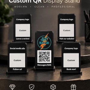 May include: Five black rectangular display stands with white panels for custom QR codes and logos. The center stand features a JMV Electric LLC logo and a QR code labeled Messages/SMS. Other stands include text for reviews, websites, social media, and booking.