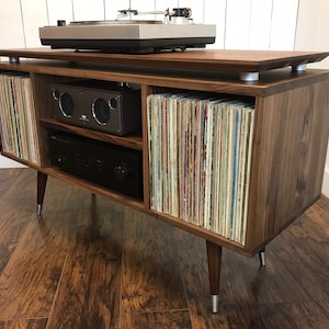 Solid walnut turntable and album storage cabinet. Mid century modern record player console with vinyl storage.