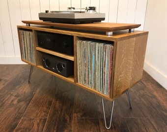 White oak turntable and stereo cabinet with album storage. Mid century modern audio console for vinyl enthusiasts.