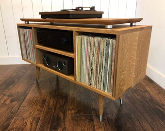 White oak turntable and stereo cabinet with album storage. Mid century modern stereo console for vinyl enthusiasts.