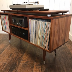 Solid mahogany turntable cabinet with album storage. Mid century modern record player console with vinyl storage.