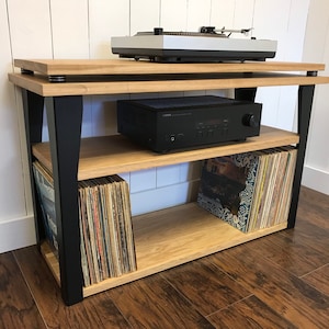 White oak stereo and turntable console with vinyl storage. Contemporary wood and steel record player stand.