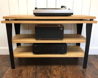 White oak stereo and turntable console with optional vinyl storage. Contemporary wood and steel record player stand.