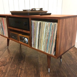 Solid mahogany turntable cabinet with album storage. Mid century modern record player console with vinyl storage.