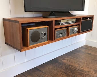 Solid mahogany floating media console. Wall mounted tv and video cabinet.