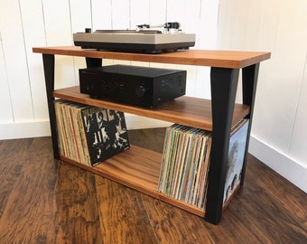 Mahogany stereo and turntable stand with vinyl storage. Modern record player console with contemporary steel legs.