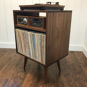 Solid walnut stereo and turntable cabinet with album storage. Mid century modern audio console with vinyl storage.