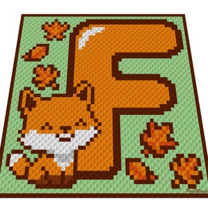 May include: A pixelated crochet design featuring a smiling orange fox and the letter "F". The fox has white accents and is surrounded by autumn leaves. The background is light green with a brown border.