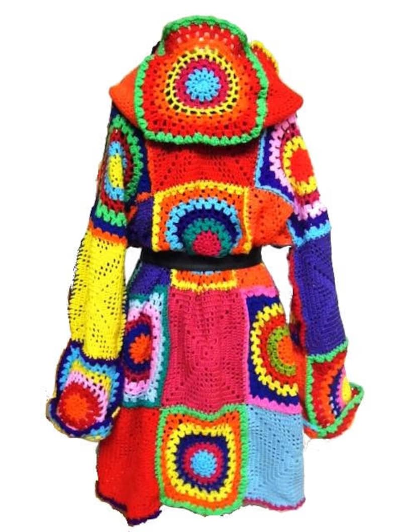 May include: A vibrant, handmade crochet coat featuring a patchwork design. The coat showcases a spectrum of colors, including red, orange, yellow, blue, and green. It has a hooded design and a fitted waist, creating a unique and eye-catching garment.