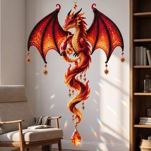 May include: A hanging dragon ornament featuring intricate red, orange, and yellow crochet-like textures with large wings. The dragon holds a glowing orb and is adorned with dangling star-shaped charms and a large, faceted amber-colored crystal drop.